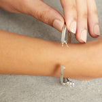 Load image into Gallery viewer, Sterling Silver And Double Crossover Cubic Zirconia Bangle JOOLS by Jenny Brown
