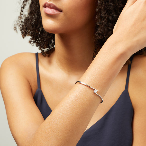 Sterling Silver Twist Bangle With A 1 Carat Tension Set Cubic Zirconia JOOLS by Jenny Brown