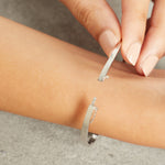 Load image into Gallery viewer, Sterling Silver Twist Bangle With A 1 Carat Tension Set Cubic Zirconia JOOLS by Jenny Brown
