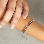 Load image into Gallery viewer, Sterling Silver Bangle Cross Over Set With Two Cubic Zirconia Stones EndsBracelets - JOOLS By Jenny Brown
