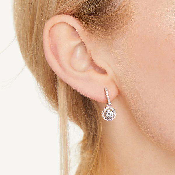 Sterling Silver Halo Drop Round Brilliant Cut Cubic Zirconia Earrings Set With A 1 Carat Centre Stone - JOOLS By Jenny Brown