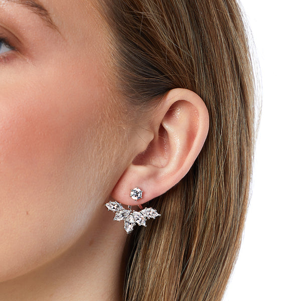 A pair of sterling silver jacket earrings featuring a lotus flower design with cubic zirconia stones, including a detachable solitaire stud earring.