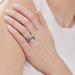 Load image into Gallery viewer, A sterling silver ring with three oval-shaped cubic zirconia stones, set in an offset design with a rhodium finish-JOOLS by Jenny Brown
