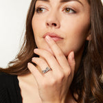 Load image into Gallery viewer, Sterling Silver and Cubic Zirconia Ring In A Cross Over Stone Set Band
