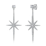 Load image into Gallery viewer, A pair of sterling silver  north star drop stud earrings with a star design and cubic zirconia stones-JOOLS by Jenny Brown
