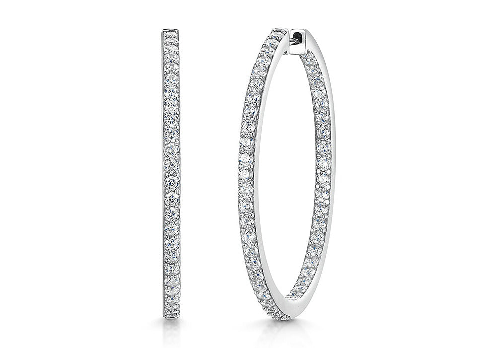 Sterling Silver Hoop Earrings Set With Cubic Zirconias.