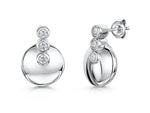 Load image into Gallery viewer, A pair of sterling silver circle earrings with three round cubic zirconia stones in a rhodium-plated finish.
