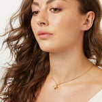 Load image into Gallery viewer, A yellow gold bee necklace with black and white cubic zirconia stones -JOOLS by Jenny Brown
