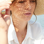 Load image into Gallery viewer, A yellow gold bee necklace with black and white cubic zirconia stones -JOOLS by Jenny Brown
