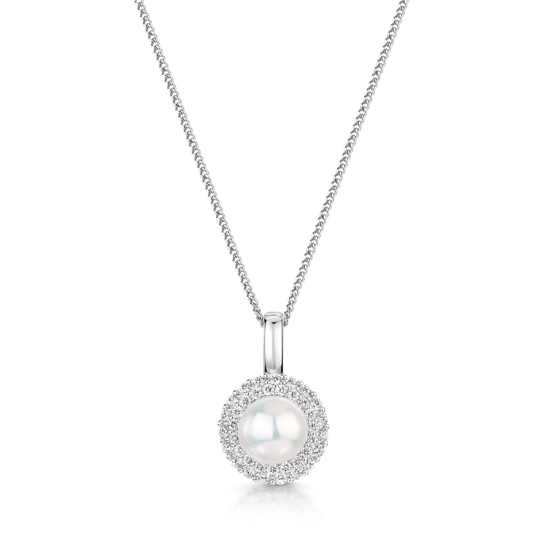 A sterling silver pendant with a central white freshwater pearl surrounded by a halo of cubic zirconia stones, on a silver chain-JOOLS by Jenny Brown
