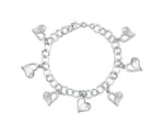 Load image into Gallery viewer, A sterling silver charm bracelet with dangly heart-shaped charms and additional cubic zirconia -JOOLS by Jenny Brown
