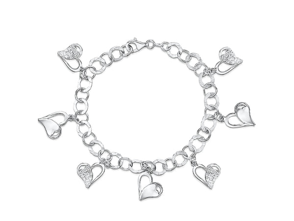 A sterling silver charm bracelet with dangly heart-shaped charms and additional cubic zirconia -JOOLS by Jenny Brown